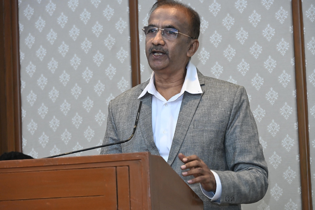 Kaushik Desai addressing capital market participants